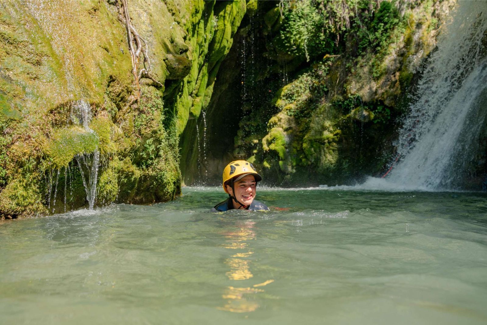 Guest abseiling down a waterfall in Drenostica Canyon